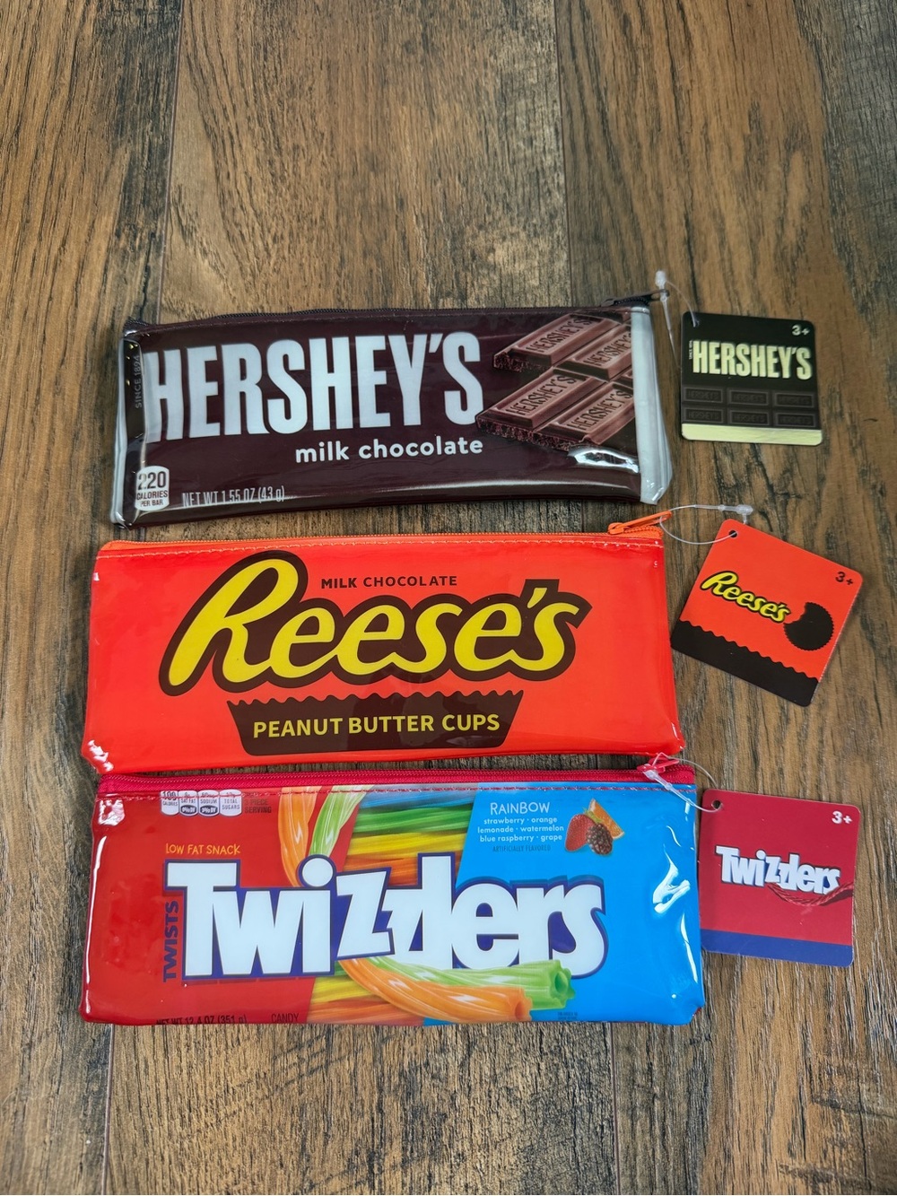 NWT Candy bar logo zipper pouches
